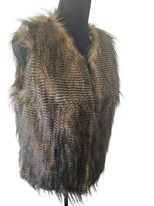 Feathered garment on a mannequin against a white background